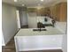 Bright kitchen featuring an island, white countertops, updated cabinets and stainless steel appliances at 954 E Henry St, Tempe, AZ 85288