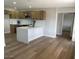 Kitchen featuring an island, stainless steel appliances, modern fixtures, and updated cabinetry at 954 E Henry St, Tempe, AZ 85288