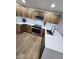 Bright kitchen featuring stainless steel appliances, updated cabinetry, and sleek countertops at 954 E Henry St, Tempe, AZ 85288