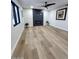 Spacious living room with wood floors, a modern fireplace, and ample natural light at 954 E Henry St, Tempe, AZ 85288
