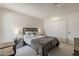 Well-lit bedroom with a large bed and closet space for ample storage at 9814 W Long Hills Dr, Sun City, AZ 85351