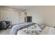 Bedroom boasts a bed, dresser, and chair with ottoman, enhancing its appeal at 9814 W Long Hills Dr, Sun City, AZ 85351