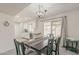 Bright dining room features a sliding glass door and a table for Gathering meals at 9814 W Long Hills Dr, Sun City, AZ 85351