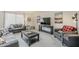 Inviting living room with modern furnishings, plush seating, and a large window for natural light at 9814 W Long Hills Dr, Sun City, AZ 85351