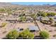 Expansive aerial view of a desert property featuring horse facilities and mountain views at 9998 W Prospector Dr, Queen Creek, AZ 85144