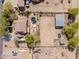 Aerial view of a home with a pool, horse facilities, a large yard, and desert landscaping at 9998 W Prospector Dr, Queen Creek, AZ 85144