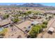 Spacious rural property featuring horse amenities, including stables and an arena, ideal for equestrian enthusiasts at 9998 W Prospector Dr, Queen Creek, AZ 85144