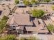 Aerial view of the home featuring a tile roof, mature landscaping, and horse facilities at 9998 W Prospector Dr, Queen Creek, AZ 85144