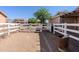Backyard view with white fencing surrounding the horse property and enclosing the back yard at 9998 W Prospector Dr, Queen Creek, AZ 85144
