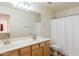 Bright bathroom with double sinks, a large mirror, and a shower/tub combo at 9998 W Prospector Dr, Queen Creek, AZ 85144
