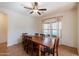 Dining room with a wooden table, chairs, and a ceiling fan at 9998 W Prospector Dr, Queen Creek, AZ 85144