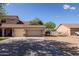 Spacious driveway leading to a three-car garage, with ample parking space and convenient access at 9998 W Prospector Dr, Queen Creek, AZ 85144
