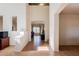 Bright foyer with tiled flooring, arched doorways, and an open view of the living room at 9998 W Prospector Dr, Queen Creek, AZ 85144