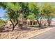 Beautiful home exterior with desert landscaping and views of the front yard at 9998 W Prospector Dr, Queen Creek, AZ 85144