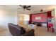 Home theater features projector, screen, comfortable seating, and classic popcorn machine for movie nights at 9998 W Prospector Dr, Queen Creek, AZ 85144