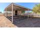 Spacious horse stall with a sheltered metal roof, ideal for equestrian enthusiasts seeking a well-equipped stable at 9998 W Prospector Dr, Queen Creek, AZ 85144