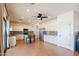 Open concept kitchen with granite countertops, stainless steel appliances, and a breakfast bar at 9998 W Prospector Dr, Queen Creek, AZ 85144