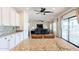 Open concept kitchen with granite countertops, stainless steel appliances, and seamless access to the living room at 9998 W Prospector Dr, Queen Creek, AZ 85144
