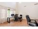 Bright home office with high ceilings, windows and multiple workstations at 9998 W Prospector Dr, Queen Creek, AZ 85144