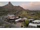 Aerial view showcasing a luxury home nestled in a desert landscape with mountain views at 10040 E Happy Valley Rd # 1011, Scottsdale, AZ 85255