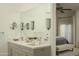 Modern bathroom with a double vanity, neutral color scheme, and direct access to the main bedroom at 10040 E Happy Valley Rd # 1011, Scottsdale, AZ 85255