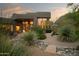 Desert home featuring drought-resistant landscaping with native plants and a stone-lined walkway at 10040 E Happy Valley Rd # 1011, Scottsdale, AZ 85255