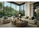 Bright, modern living room featuring a large window with views of desert landscaping and the mountains at 10040 E Happy Valley Rd # 1011, Scottsdale, AZ 85255