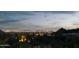 Expansive city views from the elevated lot, showcasing the illuminated skyline at night at 10040 E Happy Valley Rd # 1011, Scottsdale, AZ 85255