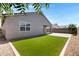 Lush backyard featuring artificial grass and low-maintenance landscaping at 1090 E Horro Rd, Queen Creek, AZ 85143