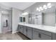 Bathroom featuring double vanity, walk-in shower, tiled floor, and large mirror at 1090 E Horro Rd, Queen Creek, AZ 85143
