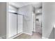 Modern bathroom featuring a glass-enclosed shower and wood-look tile floors at 1090 E Horro Rd, Queen Creek, AZ 85143