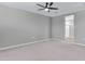 Primary bedroom with carpeted floor and ceiling fan at 1090 E Horro Rd, Queen Creek, AZ 85143
