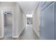 Bright hallway featuring modern tile flooring and views of the home's open layout at 1090 E Horro Rd, Queen Creek, AZ 85143