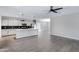 Modern kitchen with stainless steel appliances, gray cabinetry, and pendant lighting at 1090 E Horro Rd, Queen Creek, AZ 85143