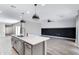 Bright kitchen featuring a center island, modern fixtures, and open access to living space at 1090 E Horro Rd, Queen Creek, AZ 85143