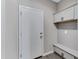 Convenient mud room featuring a bench and storage cabinets at 1090 E Horro Rd, Queen Creek, AZ 85143