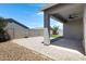 Expansive covered patio with ceiling fan and neutral colored pavers create outdoor living space at 1090 E Horro Rd, Queen Creek, AZ 85143