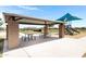 Community park picnic pavilion with tables, shade, and playground at 1090 E Horro Rd, Queen Creek, AZ 85143