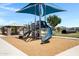 Community playground featuring play structure with slide, covered seating, and climbing area at 1090 E Horro Rd, Queen Creek, AZ 85143