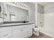 Well-lit bathroom with white vanity, granite countertop, modern fixtures, and a tub-shower combination at 1265 S Aaron -- # 341, Mesa, AZ 85209