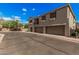 Exterior view of townhome with private garages and desert landscaping at 1265 S Aaron -- # 341, Mesa, AZ 85209