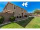 View of the exterior of the townhomes and the landscaped lawn at 1265 S Aaron -- # 341, Mesa, AZ 85209