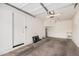 Clean, empty garage, ready for parking and storage with visible garage door opener at 1265 S Aaron -- # 341, Mesa, AZ 85209