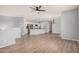 This open-concept living room flows seamlessly into the kitchen with wood flooring and modern finishes at 1265 S Aaron -- # 341, Mesa, AZ 85209