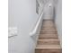 Staircase featuring wood-look steps and white handrail going to the second floor at 1265 S Aaron -- # 341, Mesa, AZ 85209