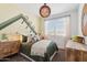 Cozy bedroom with a comfortable bed, stylish decor, neutral colors, and ample natural light from the window at 1331 S Vista Ave, Florence, AZ 85132