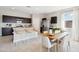 Open-concept kitchen with dark cabinetry, stainless steel appliances, and a white countertop island at 1331 S Vista Ave, Florence, AZ 85132