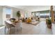 Open-concept living space with stylish furniture, neutral colors, large windows, and access to the outdoor patio at 1331 S Vista Ave, Florence, AZ 85132