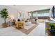 Stylish living room with modern furniture, neutral tones, decorative plants, and a bright, open atmosphere at 1331 S Vista Ave, Florence, AZ 85132