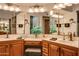 Elegant bathroom with dual sinks, vanity area and great lighting featuring decorative accessories at 13731 W Greenview Dr, Sun City West, AZ 85375
